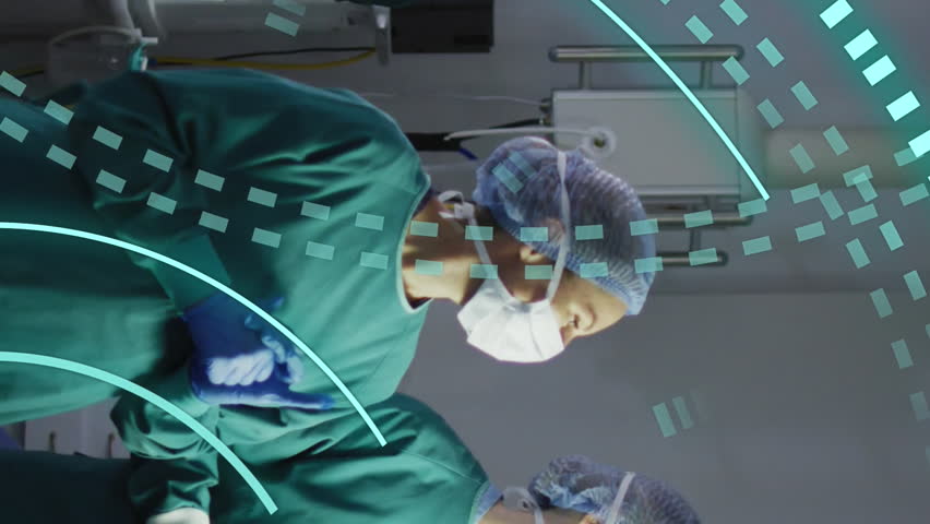 Animation of data processing rings over two diverse female surgeons talking in operating theatre. Medical and healthcare services concept digitally generated video. - Powered by Shutterstock - Get 15% off with code: PIKWIZARD15