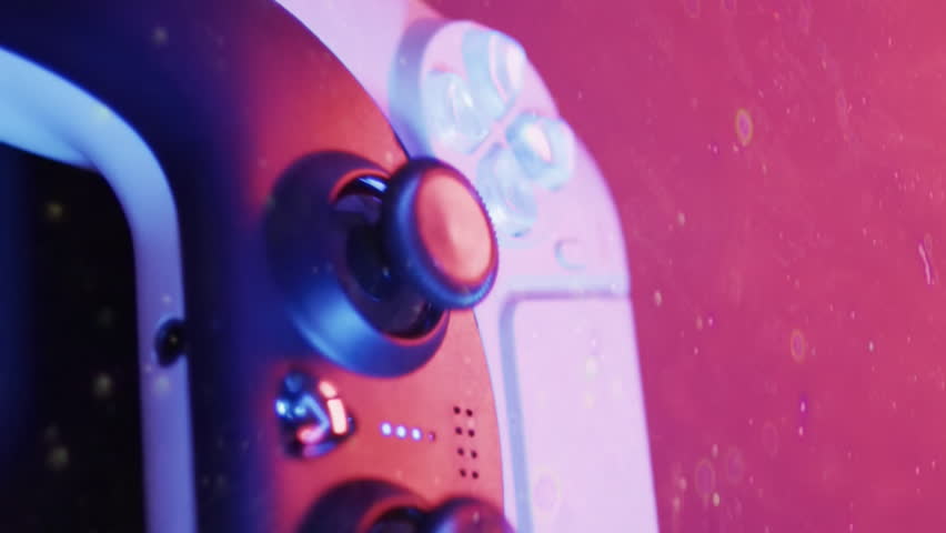 Animation of scope and data processing over video game pad. Global video game, digital interface, data processing and connections concept digitally generated video. - Powered by Shutterstock - Get 15% off with code: PIKWIZARD15