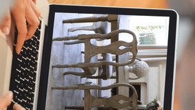 Animation of person using laptop with house dining room interiors displayed on screen. Online shopping house decorating concept digital composite. - Powered by Shutterstock - Get 15% off with code: PIKWIZARD15