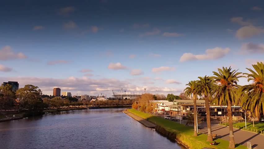 Scenic aerial or ground footage of the Yarra River flowing through Melbourne, Victoria, Australia, showcasing city skyline and urban-natural harmony.

