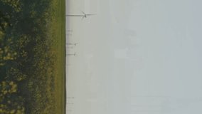 Animation of financial and stock market data processing against spinning windmills on grassland. Global economy and renewable energy technology concept - Powered by Shutterstock - Get 15% off with code: PIKWIZARD15