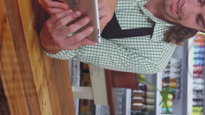 Animation of graphs and currency signs over caucasian man and woman discussing over tablet in store. Digital composite, report, finance, investment, technology, business, teamwork and merchandise. - Powered by Shutterstock - Get 15% off with code: PIKWIZARD15