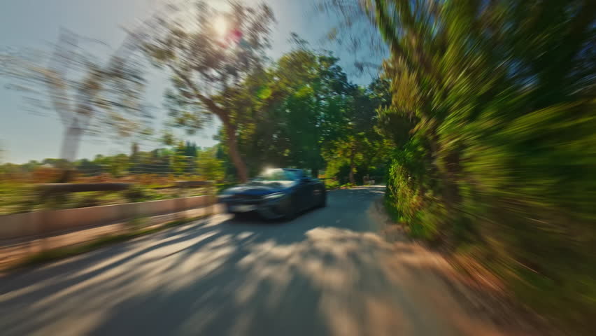 Driving a car very fast along the beautiful streets and place of France