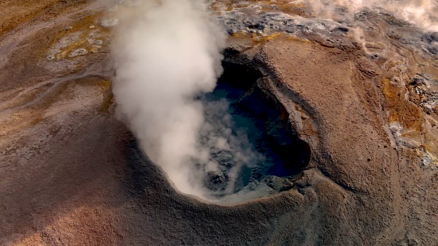 Witness the breathtaking geothermal features in Iceland, showcasing hot springs and vibrant steam rising from the earths crust. Hverir Myvatn