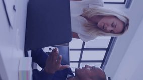 Animation of financial data processing over diverse colleagues discussing work in office. Global business, finances and digital interface concept digitally generated video. - Powered by Shutterstock - Get 15% off with code: PIKWIZARD15