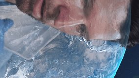 Caucasian male doctor with face mask hanging onto his ear against globe on blue background. medical treatment during covid 19 pandemic - Powered by Shutterstock - Get 15% off with code: PIKWIZARD15