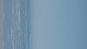 American flag waving over us map over radial stripes against view of the beach. american independence patriotic holiday concept - Powered by Shutterstock - Get 15% off with code: PIKWIZARD15