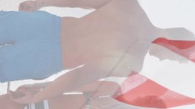 American flag falling against rear view of caucasian couple hugging on the beach. american independence patriotic holiday concept - Powered by Shutterstock - Get 15% off with code: PIKWIZARD15