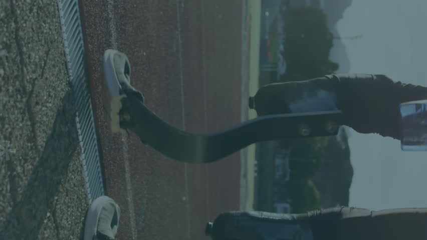 Animation of digital data processing over disabled male athlete with running blades on racing track. global sports, competition, disability and digital interface concept digitally generated video. - Powered by Shutterstock - Get 15% off with code: PIKWIZARD15