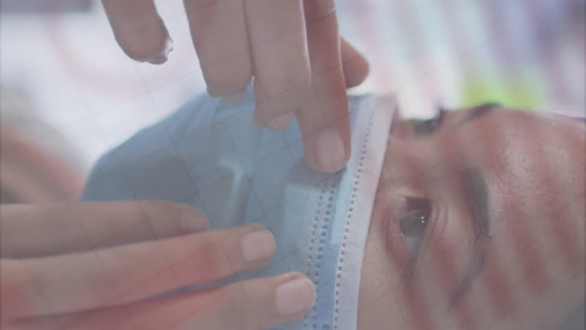 Animation of covid 19 cells floating and statistics over woman wearing face mask. workplace and business during covid 19 pandemic concept digitally generated video. - Powered by Shutterstock - Get 15% off with code: PIKWIZARD15