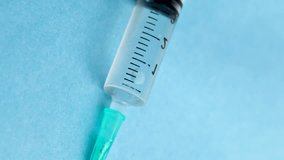 Animation of data processing over syringe. Global medicine, vaccination, healthcare and data processing concept digitally generated video. - Powered by Shutterstock - Get 15% off with code: PIKWIZARD15