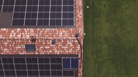 Aerial Video Thumbnail of House Roof with Solar Panels and Green Lawn – Sustainable Home Concept - Powered by Shutterstock - Get 15% off with code: PIKWIZARD15