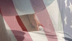 Animation of flag of usa over happy senior couple in love embracing on beach. American patriotism, nationality, summer and diversity concept digitally generated video. - Powered by Shutterstock - Get 15% off with code: PIKWIZARD15