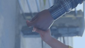 Animation of red heart icons floating over mid section of couple in love holding hands by seaside. Happy Valentines Day celebration concept digitally generated image. - Powered by Shutterstock - Get 15% off with code: PIKWIZARD15