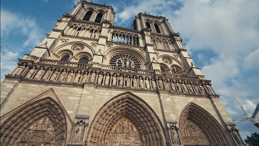 Famous Notre Dame cathedral in the heart of Paris France surrounded by beautiful historical buildings and tourist streets in the old city center of the capital