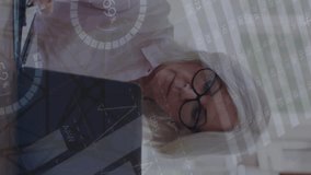 Animation of infographic interface, electricity pylon. Caucasian senior entrepreneur working at desk. Digital composite, business, report, - Powered by Shutterstock - Get 15% off with code: PIKWIZARD15