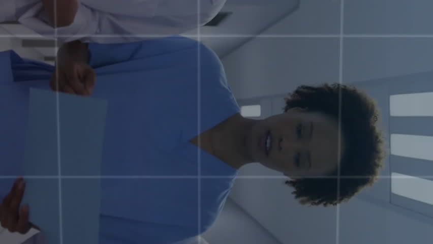 Animation graphs and map over diverse doctors discussing patient reports while walking in corridor. Digital composite, multiple exposure, business, teamwork, global, medical and healthcare concept. - Powered by Shutterstock - Get 15% off with code: PIKWIZARD15