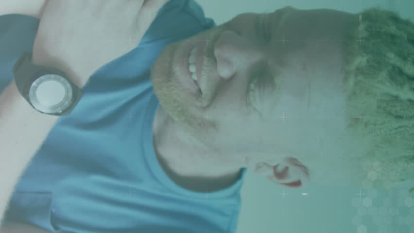 Animation of multiple icons over portrait of smiling african american albino man touching arm. Digital composite, multiple exposure, caduceus, injected, medical, healthcare and technology concept. - Powered by Shutterstock - Get 15% off with code: PIKWIZARD15