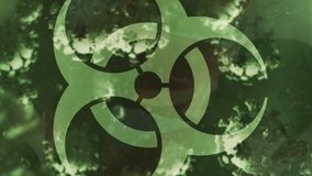 Animation of virus cells floating and biohazard symbol over group of football players. global sport during covid 19 pandemic concept digitally generated video. - Powered by Shutterstock - Get 15% off with code: PIKWIZARD15