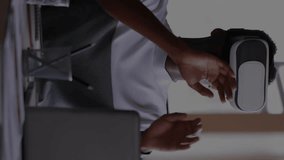 Animation of graphs with changing numbers, african american man gesturing and using vr headset. Digital composite, multiple exposure, report, business, growth and technology concept. - Powered by Shutterstock - Get 15% off with code: PIKWIZARD15