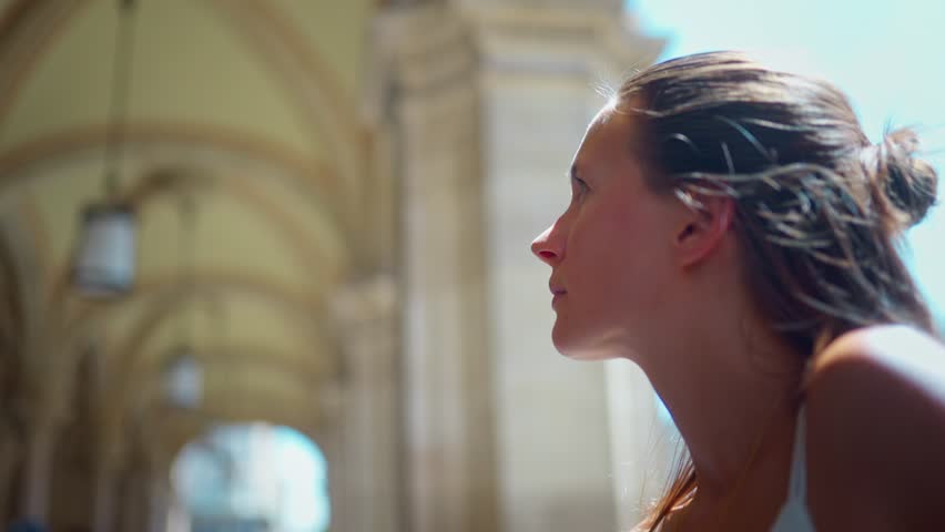 Young woman in white dress walking and exploring downtown Vienna