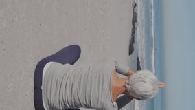 Animation of speech bubble with thumbs up icon and numbers over woman practicing yoga on beach. digital interface, social media and global network concept digitally generated video. - Powered by Shutterstock - Get 15% off with code: PIKWIZARD15