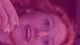 Animation of data processing over caucasian woman eating popcorn in cinema. popcorn day and celebration concept digitally generated video. - Powered by Shutterstock - Get 15% off with code: PIKWIZARD15