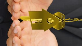 Animation of golden house keys and house shaped key fob spinning over cupped hands of a Caucasian man 4k - Powered by Shutterstock - Get 15% off with code: PIKWIZARD15