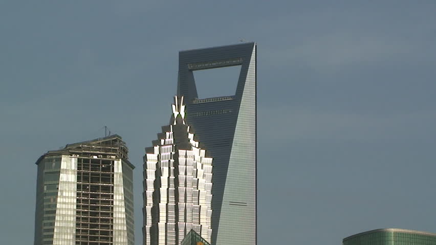 Two grand skyscrapers on a clear day in Shanghai