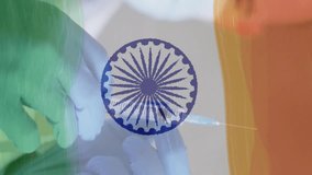 Composition of covid 19 cells and male doctor with face mask and vaccine over indian flag. global covid 19 pandemic indian healthcare crisis concept digitally generated video. - Powered by Shutterstock - Get 15% off with code: PIKWIZARD15