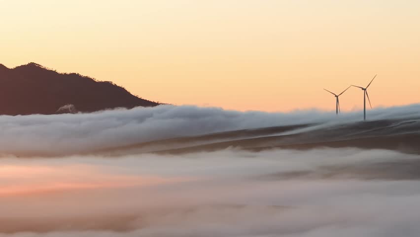 Aerial view of wind turbines in mist, South Africa.