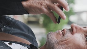 Animation of social media icons over senior man using smartphone. social media and communication concept digitally generated video. - Powered by Shutterstock - Get 15% off with code: PIKWIZARD15