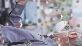 Animation of covid 19 cells over senior man wearing face mask. global covid 19 pandemic and vaccination concept digitally generated video. - Powered by Shutterstock - Get 15% off with code: PIKWIZARD15
