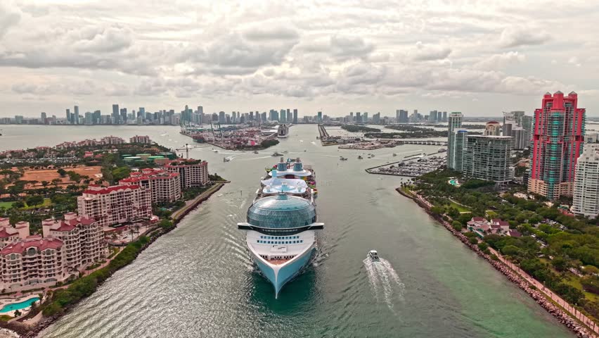 Aerial view of cruise in summer vacation. Cruise ship tour and travel at sea. Aerial view of luxury liner voyage. Ship leaving Miami beach port. Miami tour. Cruise ship voyage. Embark on a journey