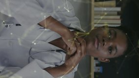 Animation of data processing over african american female doctor. Global medicine, computing and data processing concept digitally generated video. - Powered by Shutterstock - Get 15% off with code: PIKWIZARD15
