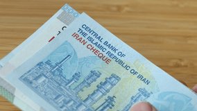 Iran money. Financial and business concept. Iranian economy, rising prices, rial banknote converter - Powered by Shutterstock - Get 15% off with code: PIKWIZARD15