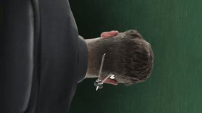 Animation of icons and mathematical equations over caucasian businessman on green background. Education, learning, knowledge, science and digital interface concept digitally generated video. - Powered by Shutterstock - Get 15% off with code: PIKWIZARD15