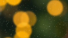 Swinging black and gold christmas baubles, falling snow and orange bokeh lights on dark background. Christmas, decorations, tradition and celebration digitally generated video. - Powered by Shutterstock - Get 15% off with code: PIKWIZARD15