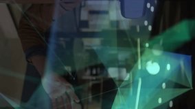 Animation of shapes over businessman smiling and using vr headset. global networks, business, data processing and digital interface concept digitally generated video. - Powered by Shutterstock - Get 15% off with code: PIKWIZARD15