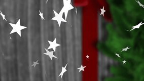 Animation of christmas snowflakes and stars falling over christmas present. christmas, tradition and celebration concept digitally generated video. - Powered by Shutterstock - Get 15% off with code: PIKWIZARD15