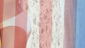 Animation of american flag over caucasian woman relaxing on beach by sea. American patriotism, independence and lifestyle concept digitally generated video. - Powered by Shutterstock - Get 15% off with code: PIKWIZARD15