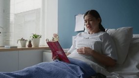 Smiling expecting mom reading aloud book called merry Christmas for her little baby in womb - Powered by Shutterstock - Get 15% off with code: PIKWIZARD15
