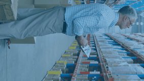 Animation of data processing on screens over caucasian man working in warehouse. Global shipping, networks, computing and data processing concept digitally generated video. - Powered by Shutterstock - Get 15% off with code: PIKWIZARD15