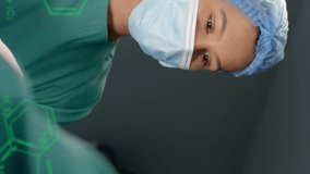 Animation of scientific data processing over diverse surgeons in hospital. Global medicine, science, data processing and digital interface concept digitally generated video. - Powered by Shutterstock - Get 15% off with code: PIKWIZARD15