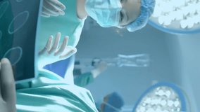 Animation of dna strand and scientific data processing over diverse surgeons in hospital. Global medicine, science, data processing and digital interface concept digitally generated video. - Powered by Shutterstock - Get 15% off with code: PIKWIZARD15