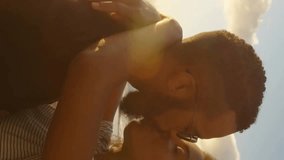 Animation of spots of light over happy diverse couple embracing by sea. Love, relationship, home and lifestyle concept digitally generated video. - Powered by Shutterstock - Get 15% off with code: PIKWIZARD15