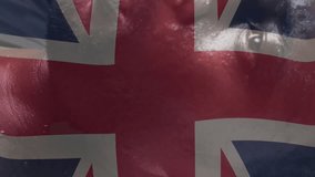 Animation of flag of uk over sportsman. Sport, flags and digital interface concept digitally generated video. - Powered by Shutterstock - Get 15% off with code: PIKWIZARD15