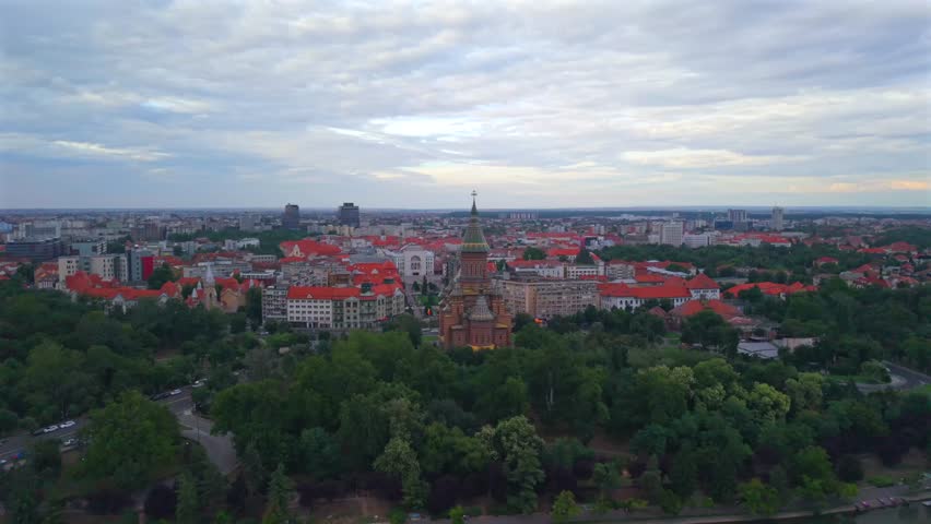 Aerial View of Timisoara City Center in Romania with Metropolitan Cathedral and Victory Square.
