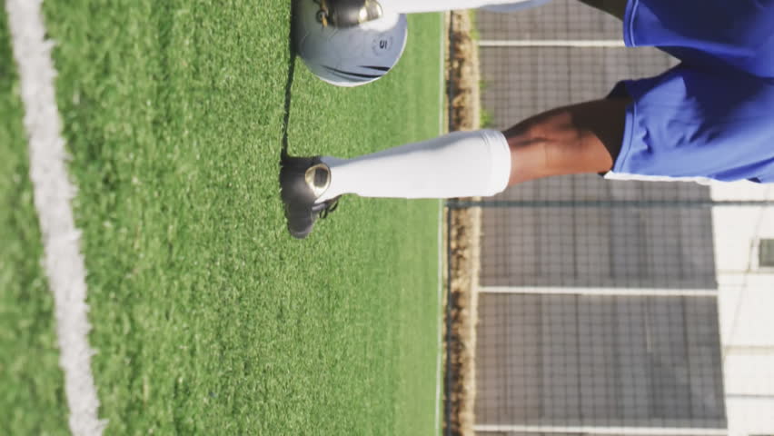Social media concept icons against african american male soccer player practicing on sports field. Social media networking technology and sports concept - Powered by Shutterstock - Get 15% off with code: PIKWIZARD15