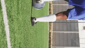 Social media concept icons against african american male soccer player practicing on sports field. Social media networking technology and sports concept - Powered by Shutterstock - Get 15% off with code: PIKWIZARD15